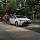 A photo of a white Toyota Corolla sedan parked on a street.